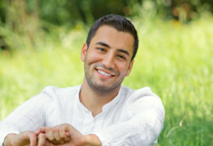 man relaxing in field